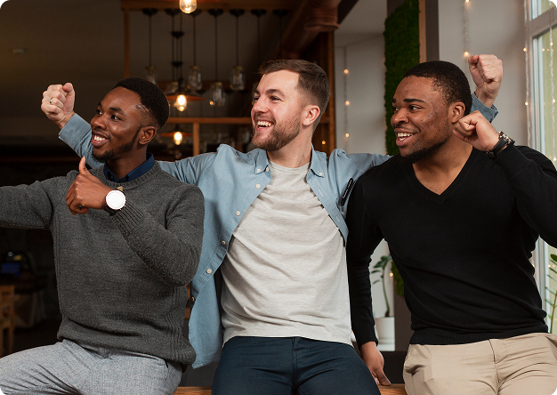 Three men celebrating together